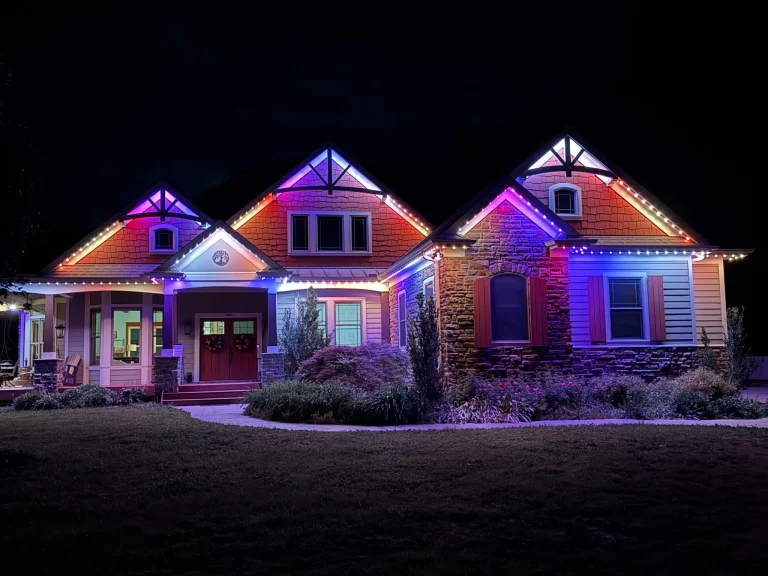 Red, white and blue light pattern along a roofline