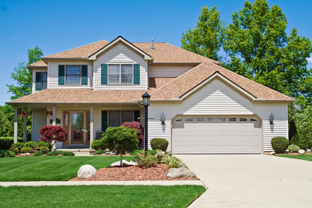 Suburban home with a shingle roof